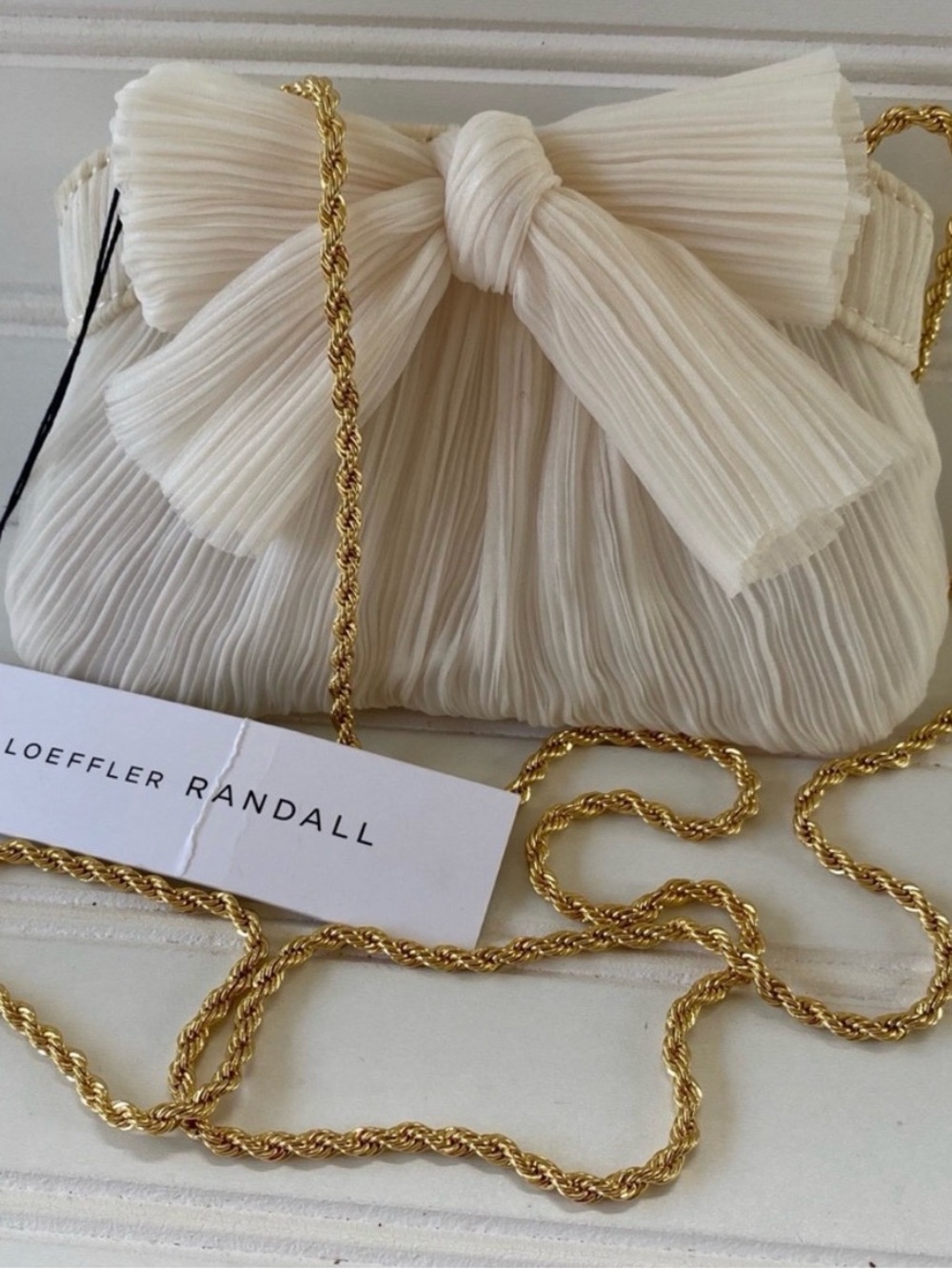 New Loeffler Randall Rochelle
Mini Pleated Frame Bow Clutch in Pearl White Bag
